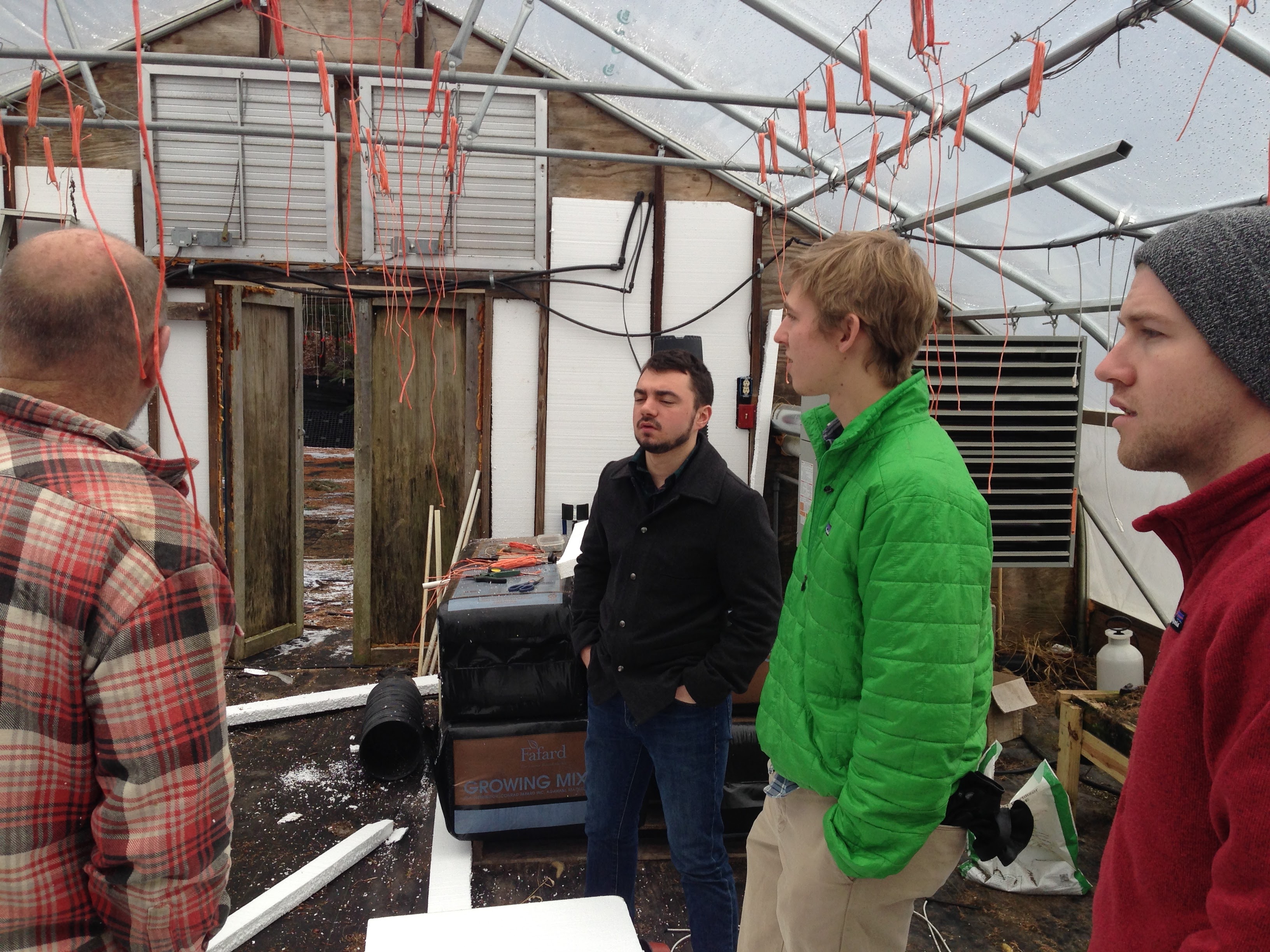 Nick Ambrogi, Jamie Byron, Dave Bowker, and me (behind the camera) on a customer research trip from January 2014 interviewing a New England greenhouse farmer.